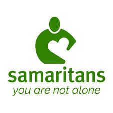 Green Samaritans logo: stylized person embracing a heart. Text reads