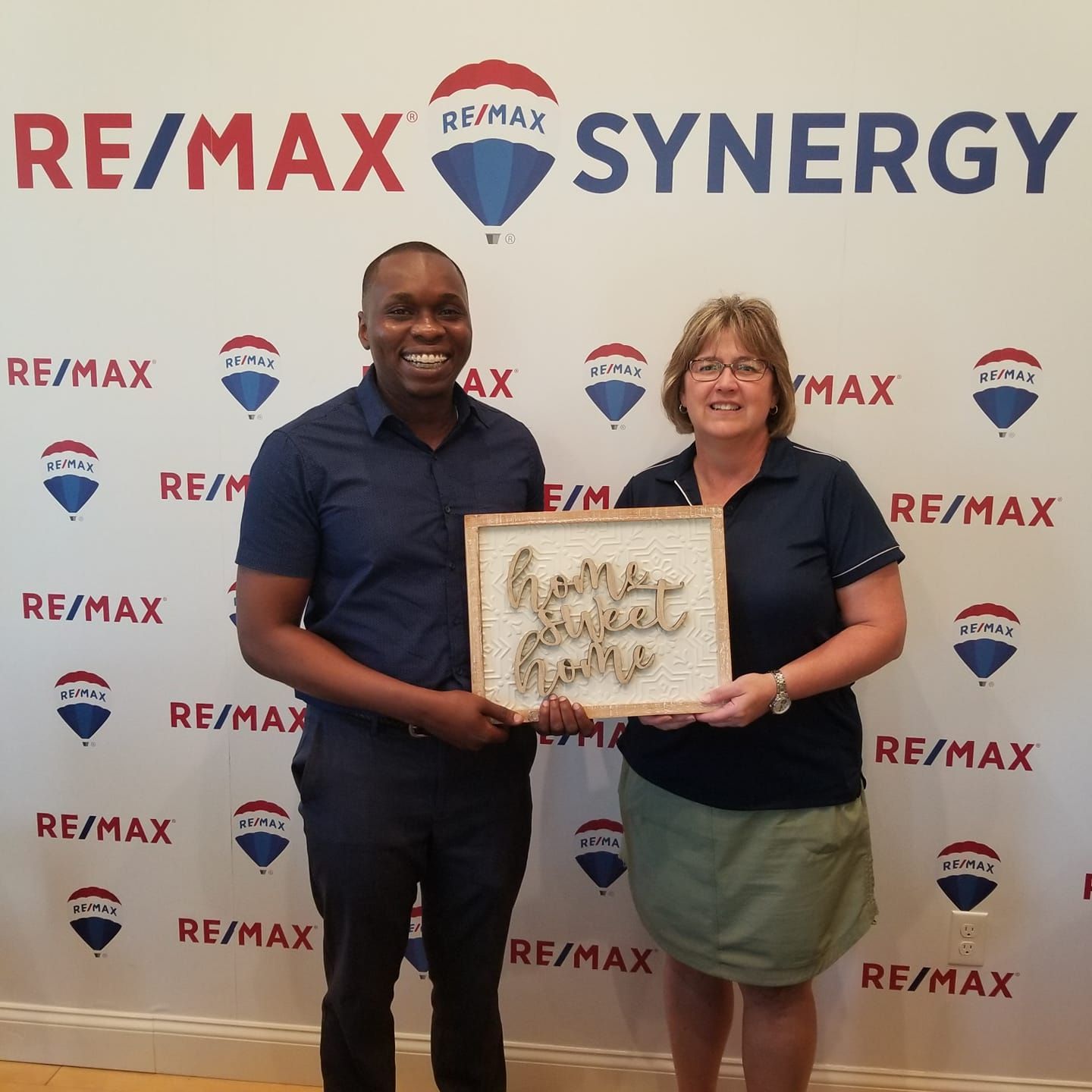 Two people holding a