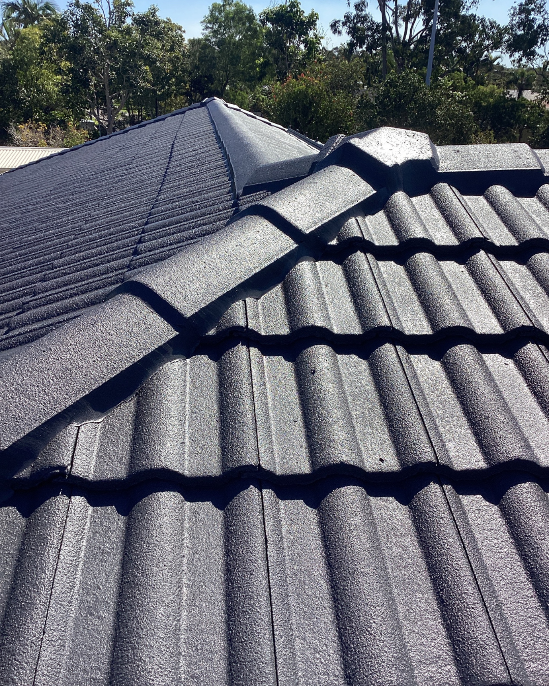 Modern House Exterior With Brick, Wooden Door, and Landscaping — Over the Top Roofing Specialists in Kunda Park, QLD