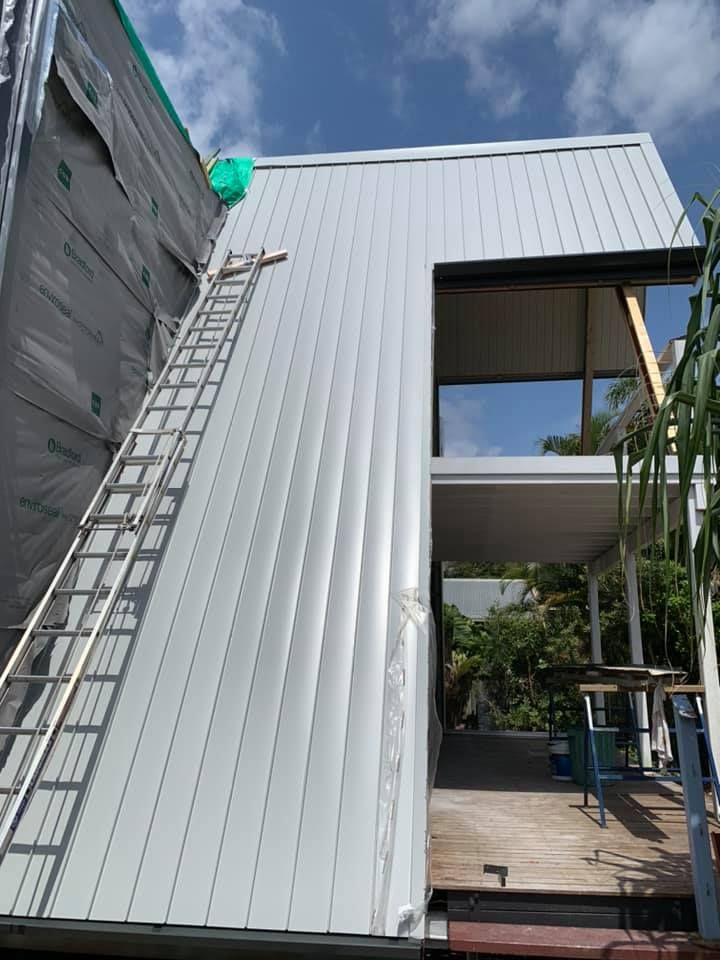 Exterior of Building Under Construction With Metal Siding — Over the Top Roofing Specialists in Kunda Park, QLD