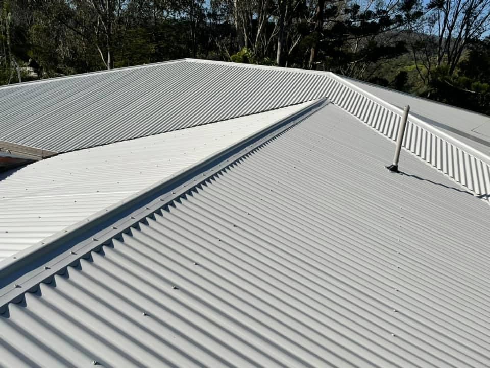 Grey Corrugated Metal Roof of a House — Over the Top Roofing Specialists in Buderim, QLD