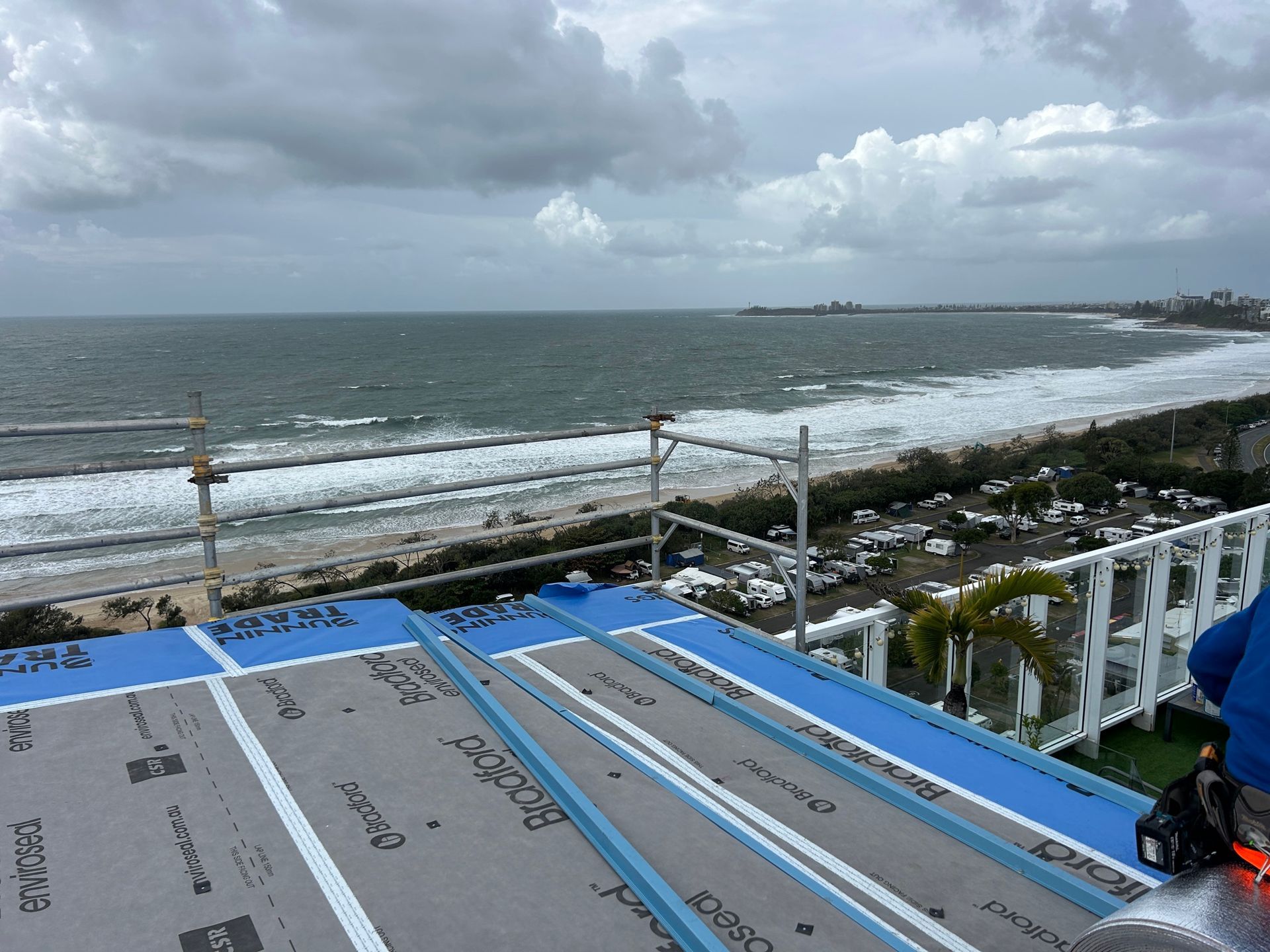 Rooftop With Blue and Gray Roofing Material — Over the Top Roofing Specialists in Kunda Park, QLD