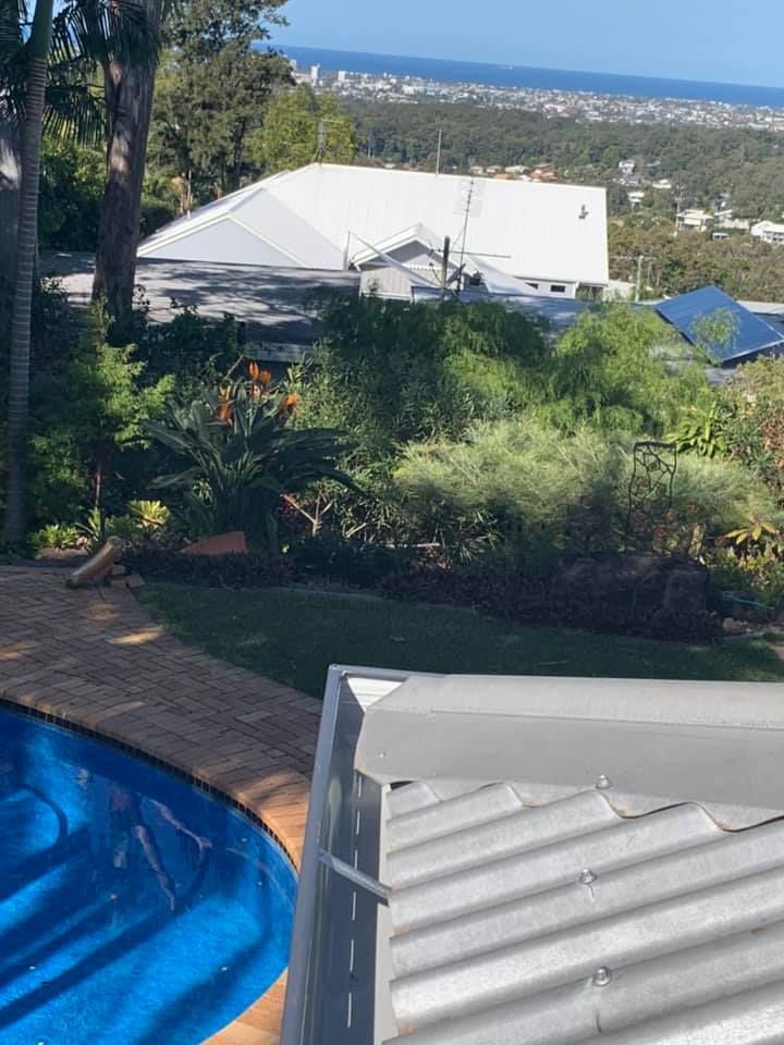 View of House With White Roof From a Rooftop — Over the Top Roofing Specialists in Caloundra, QLD