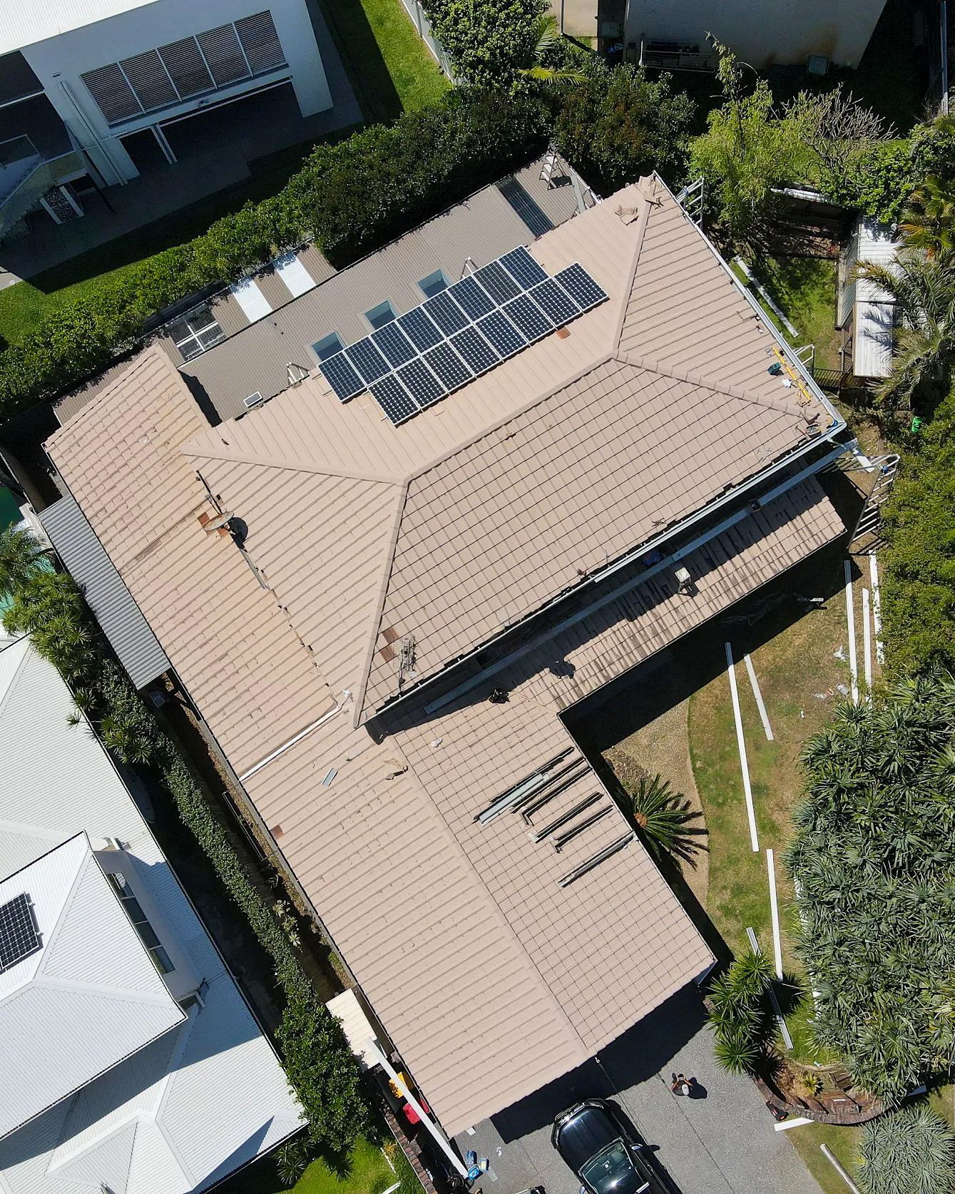 Aerial View of a House With Solar Panels on the Roof — Over the Top Roofing Specialists in Kunda Park, QLD