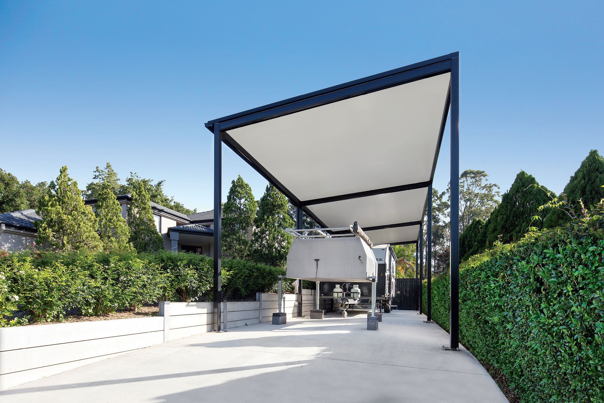 Carport With a White Canopy and Black Frame — Over the Top Roofing Specialists in Kunda Park, QLD