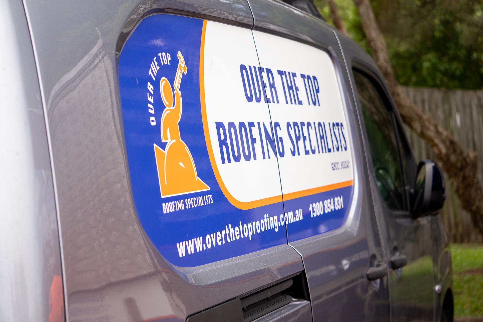 Over the Top Roofing Specialists Logo on a Van Window — Over the Top Roofing Specialists in Kunda Park, QLD