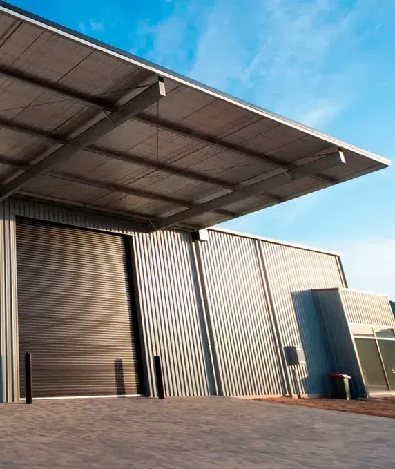 Warehouse With Corrugated Metal Walls and Roof — Over the Top Roofing Specialists in Kunda Park, QLD