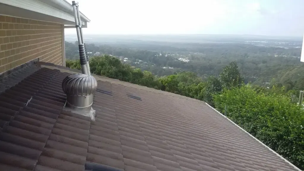 Brown Tiled Roof With a Spinning Vent — Over the Top Roofing Specialists in Caloundra, QLD