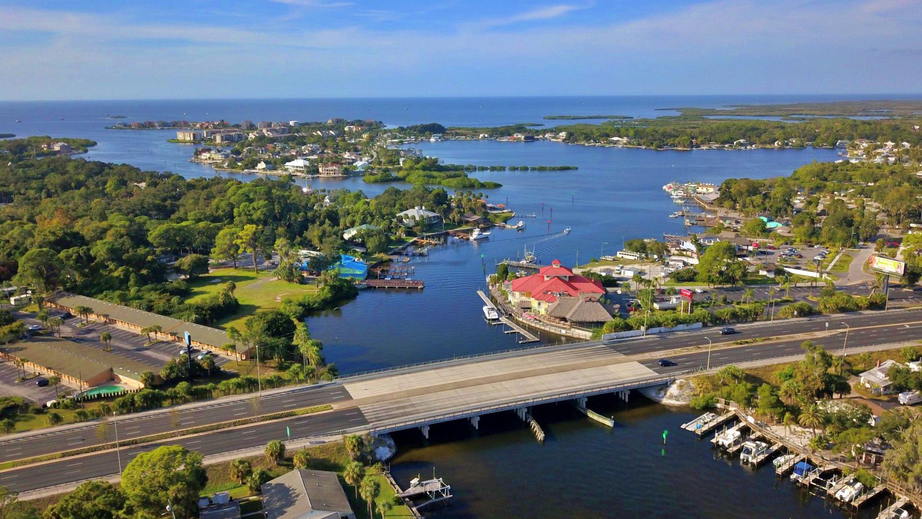 An aerial view of a residential neighborhood with mountains in the background.