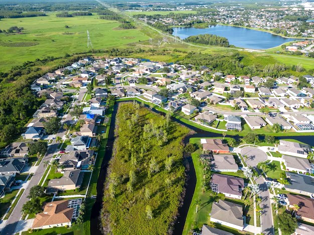 A large house with a fire hydrant in front of it
