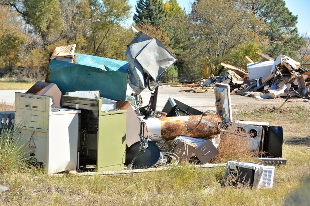 A pile of junk is sitting on the side of the road