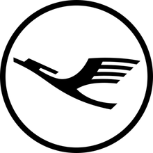 Lufthansa-Logo: Schwarzer Kranich im Flug in einem schwarzen Kreis.