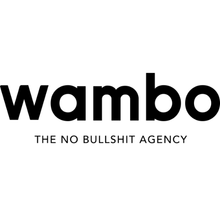 Schwarzes „Wambo“-Logo mit „THE NO BULLSHIT AGENCY“ darunter.