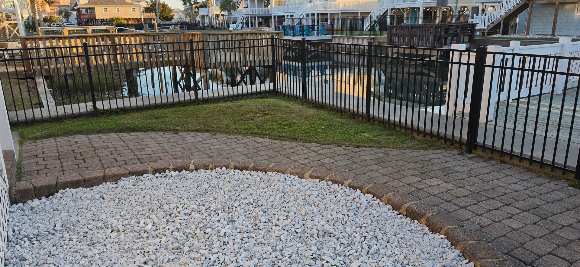A man wearing a hard hat and goggles is standing in a room.