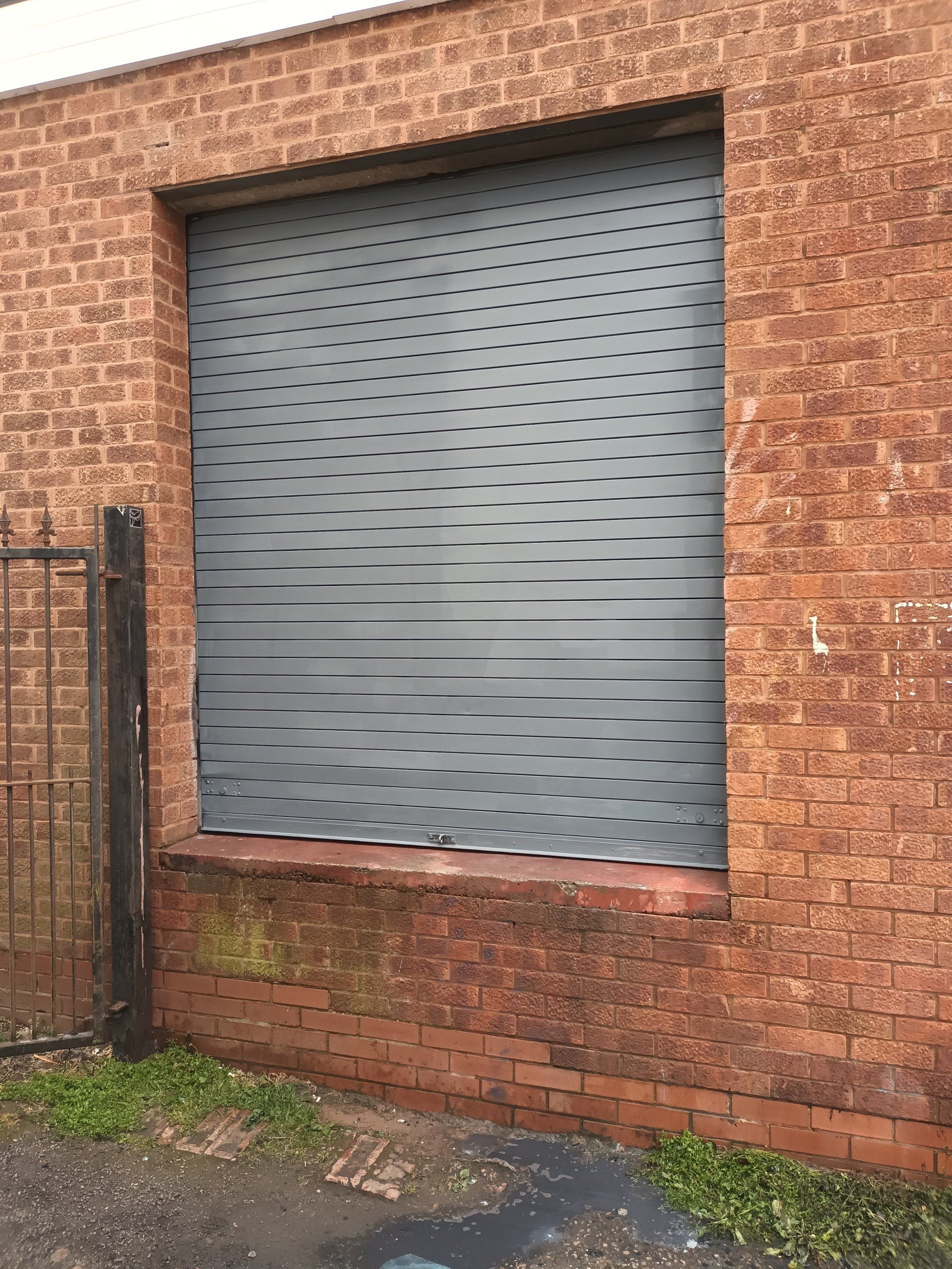 shop shutter painted in grey