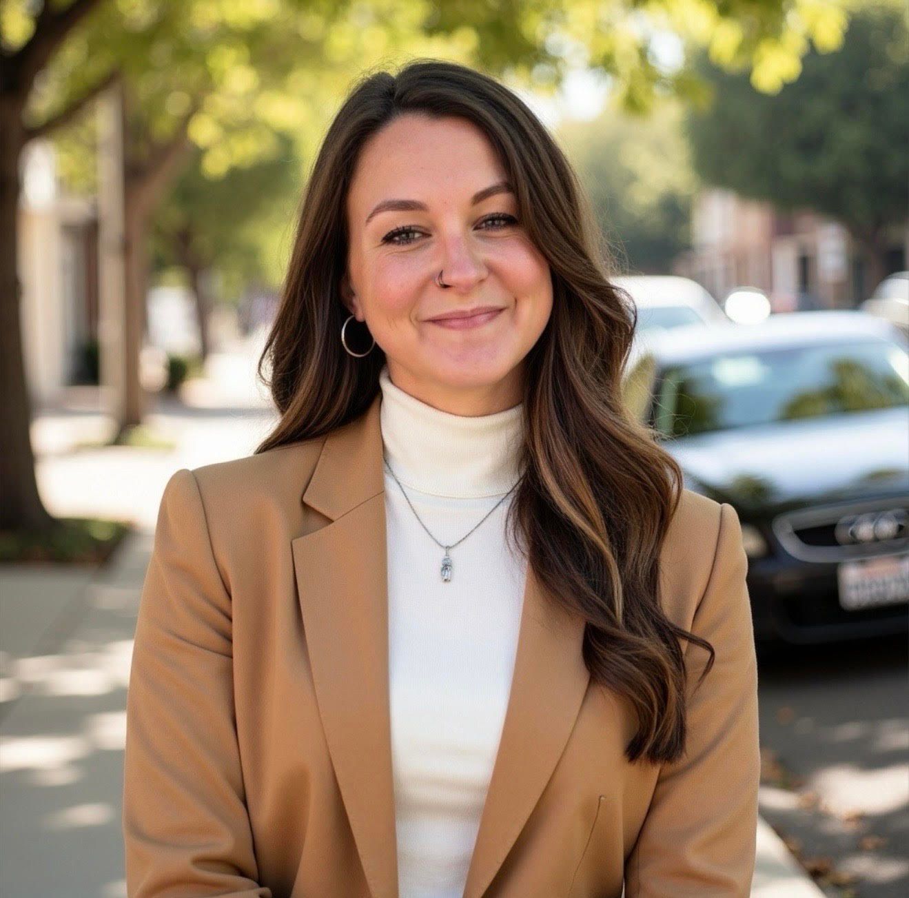 A woman with a nose ring is smiling for the camera.