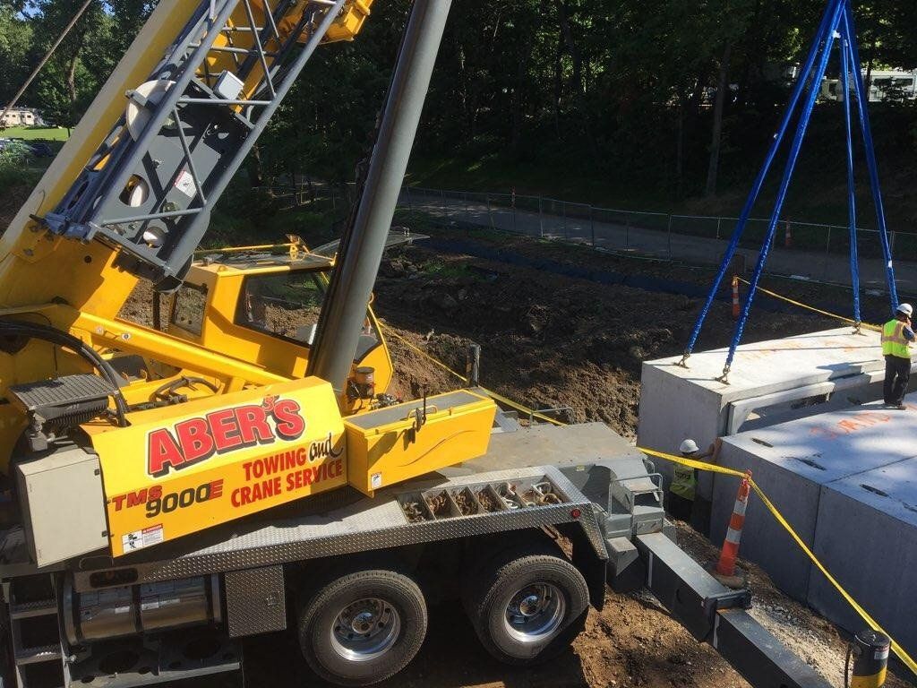 A yellow crane with the word amers on the side