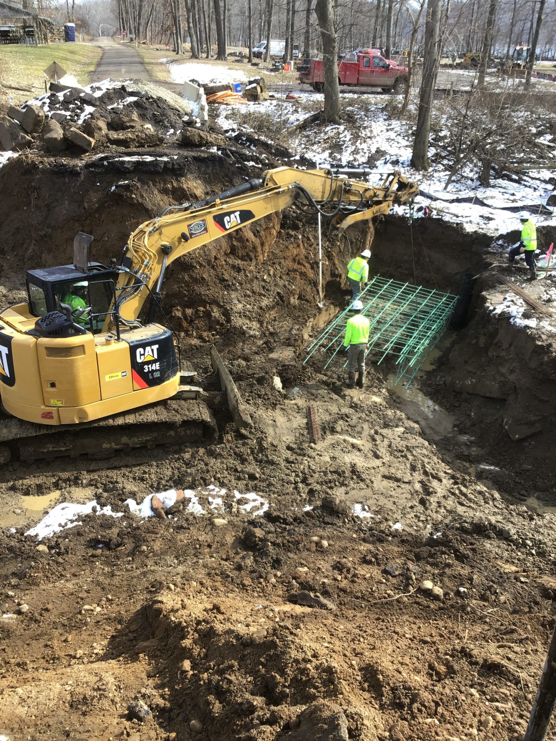 A large excavator is digging a hole in the ground.