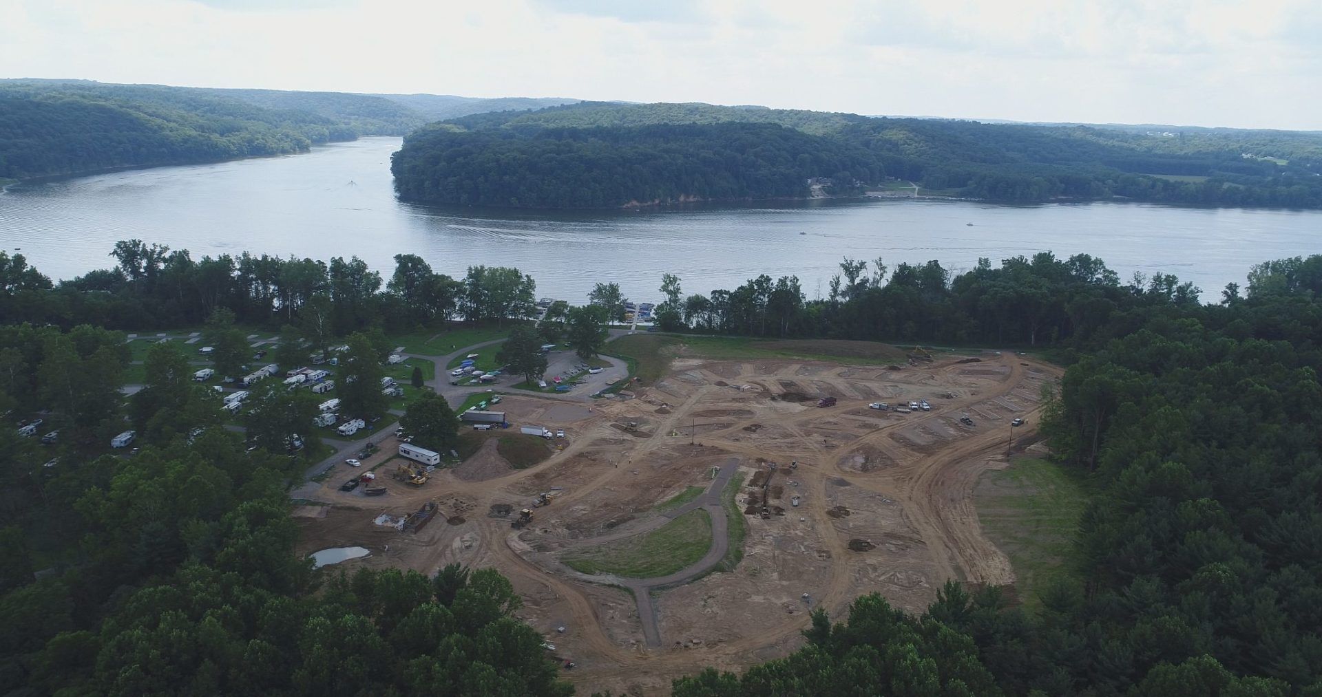 An aerial view of a large body of water surrounded by trees