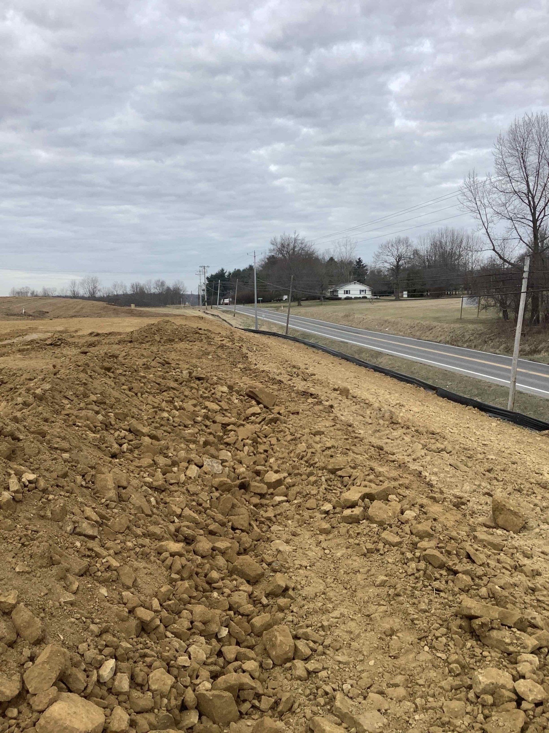 There is a lot of dirt on the side of the road.