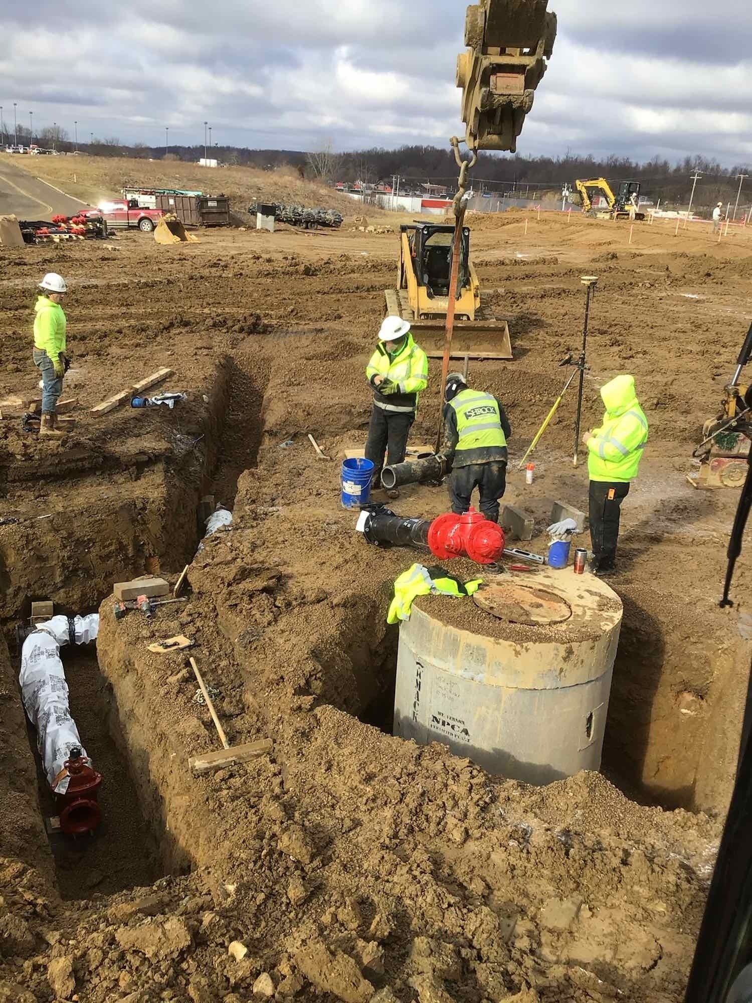 A group of construction workers are working on a construction site.