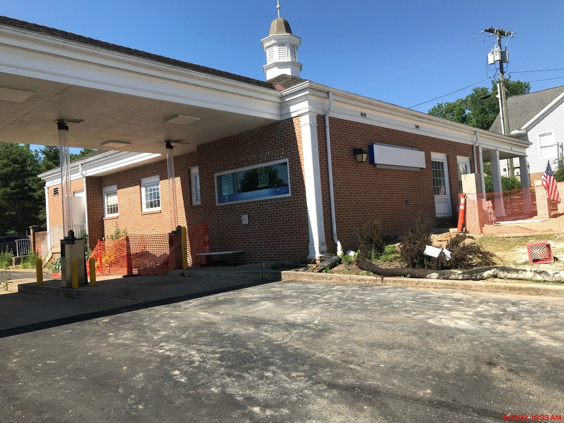 A brick building with a clock tower on top of it.