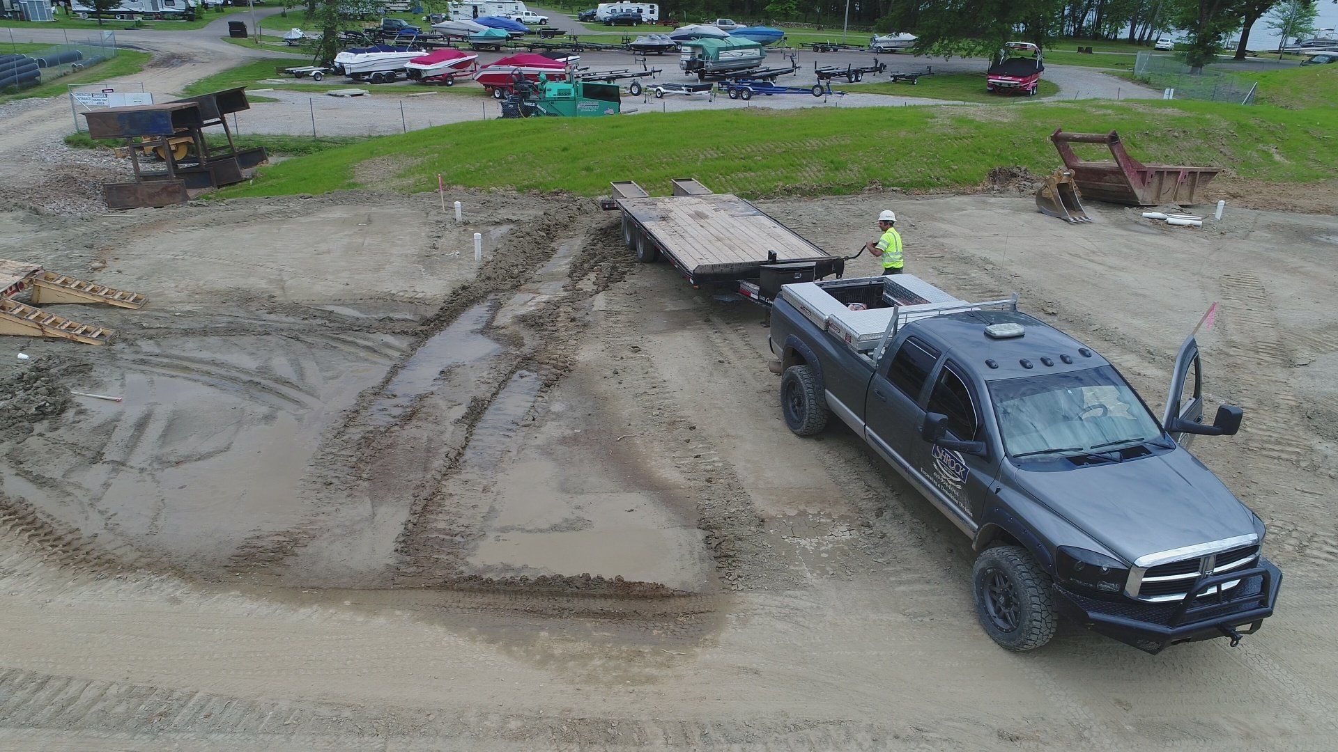 An aerial view of a construction site with a truck and trailer