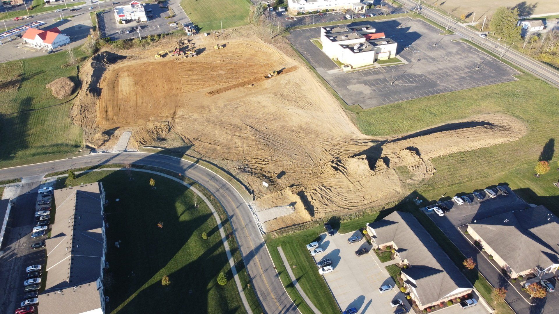 An aerial view of a construction site with a lot of dirt