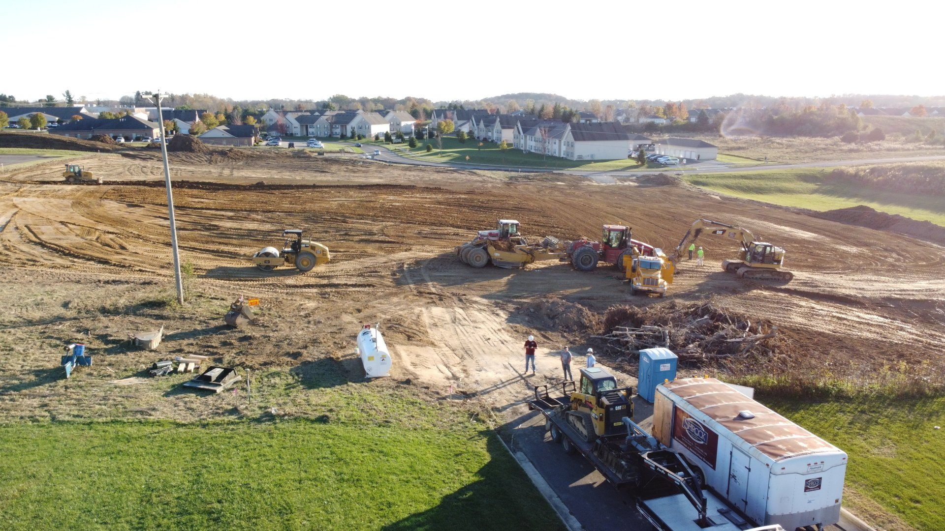 An aerial view of a construction site with tractors and bulldozers.