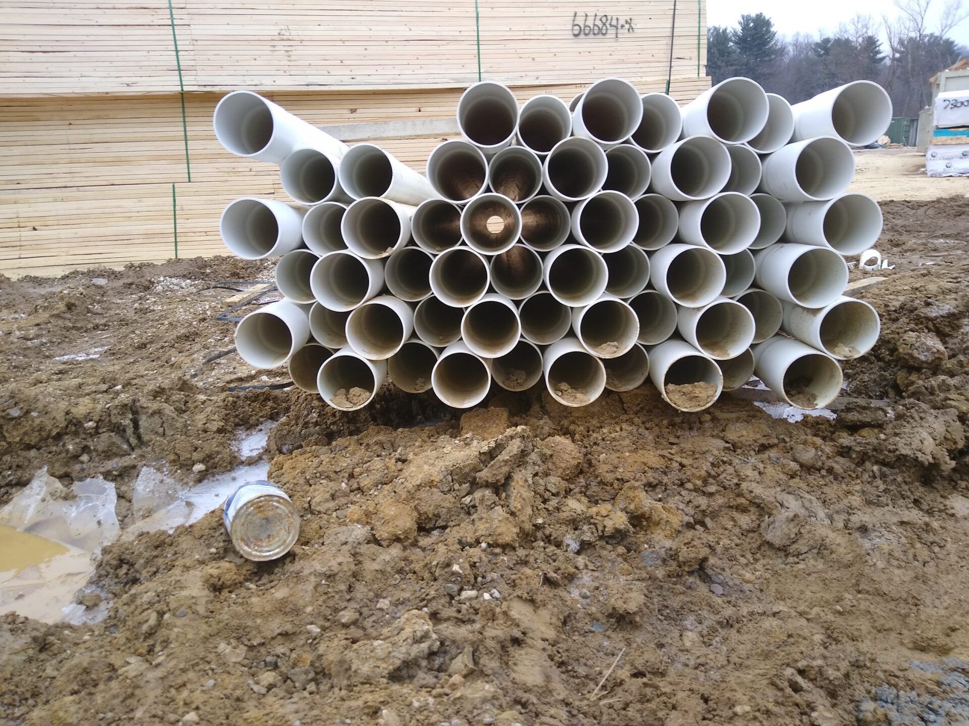A bunch of pipes are stacked on top of each other
