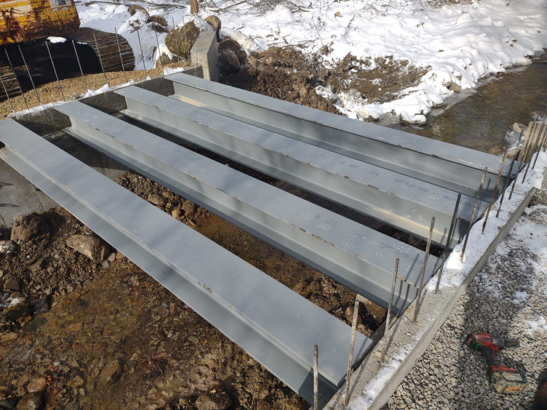 A bunch of metal pieces are laying on the ground