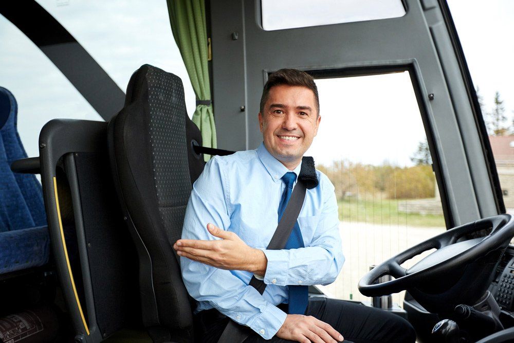 Happy Driver Inviting on Board — Coaches in Lismore, NSW