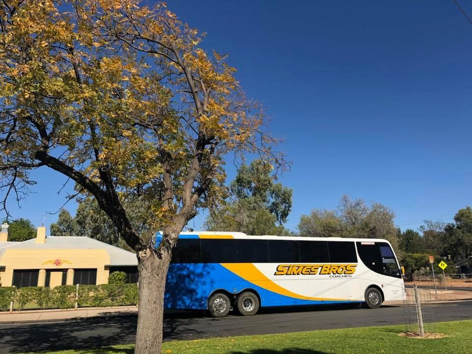 bus driving down the road — Coach Trips in Lismore, NSW