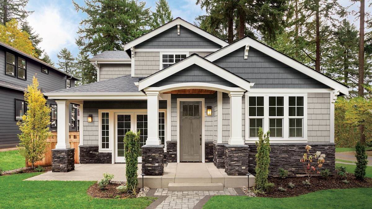 House with Patio and Stone Veneer Design — Topeka, KS — Martinek & Flynn Siding & Windows