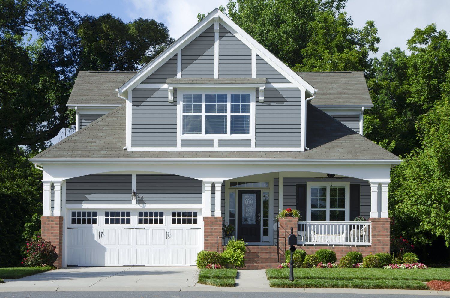 Two Storey House with White and Gray Finish — Topeka, KS — Martinek & Flynn Siding & Windows