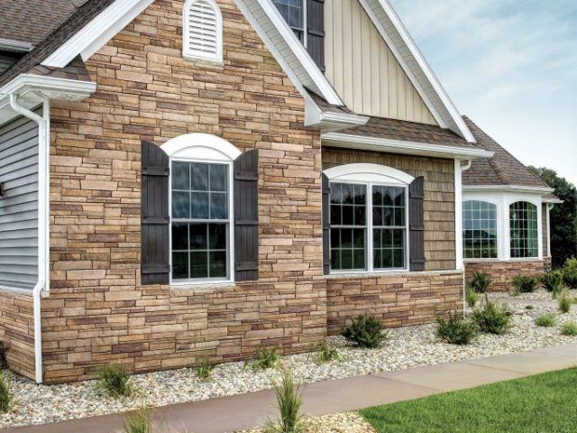 House with Stone Veneer — Topeka, KS — Martinek & Flynn Siding & Windows