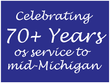 A blue sign that says celebrating 70+ years of service to mid-michigan