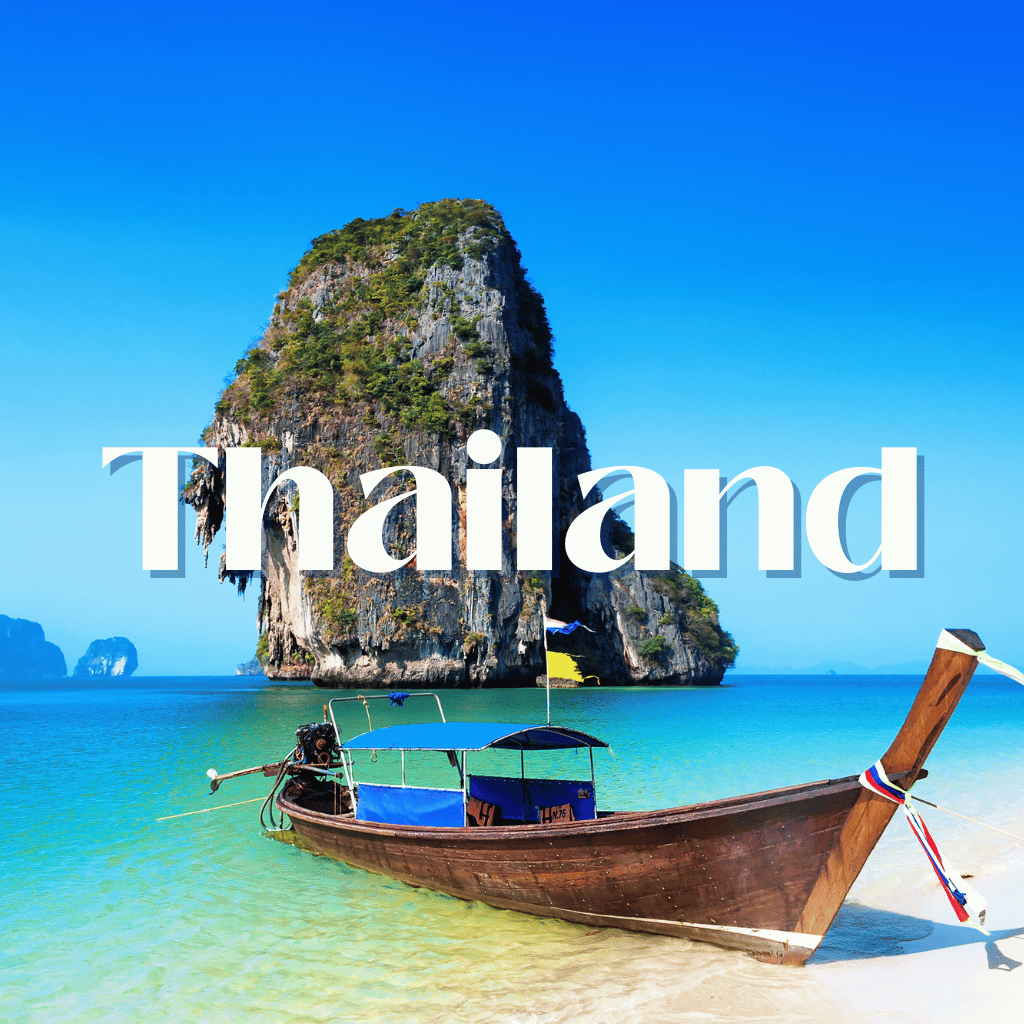 A boat on a beach with the word thailand above it