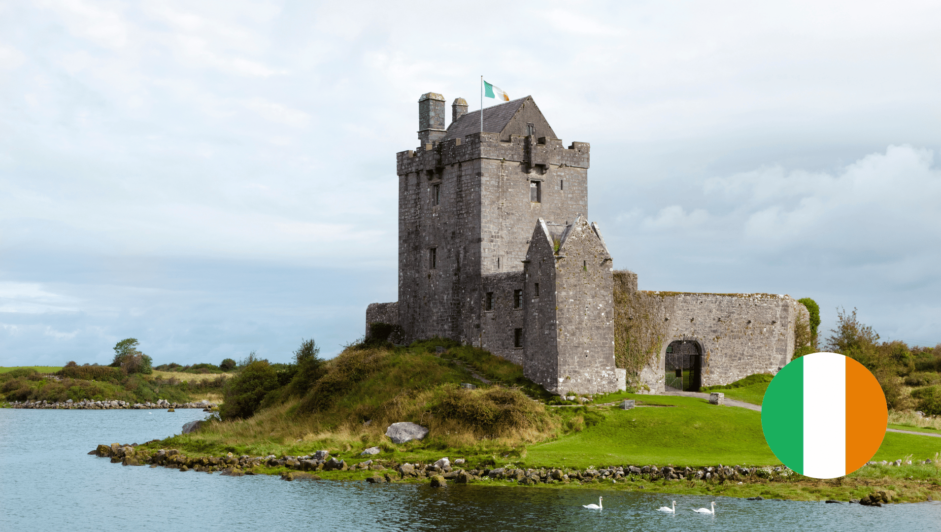 A castle is sitting on top of a small island in the middle of a lake.