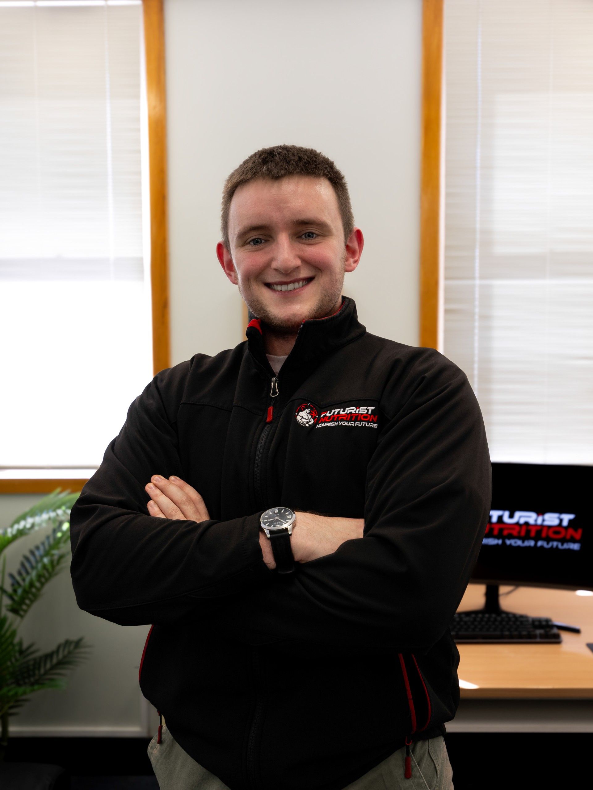 A man in a black jacket with the word tourist on it