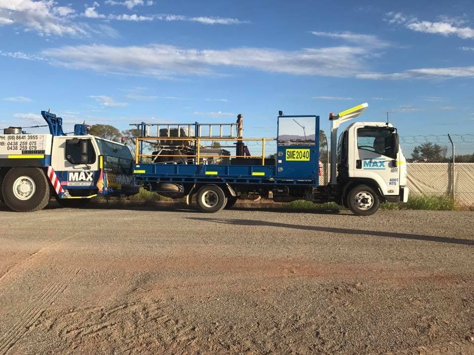Two Trucks Are Parked Next to Each Other on a Dirt Road — RK Diesel Services in Ciccone, NT