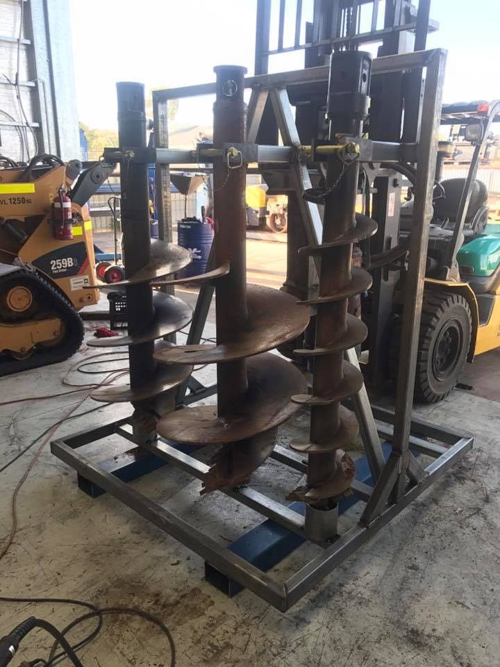 A Forklift is Sitting Next to a Pile of Drill Bits — RK Diesel Services in Elizabeth, SA