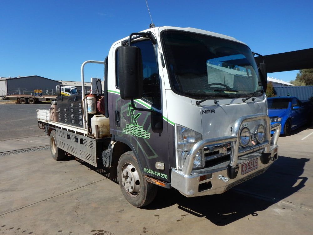 A White Truck is Parked in a Parking Lot — RK Diesel Services in Ciccone, NT