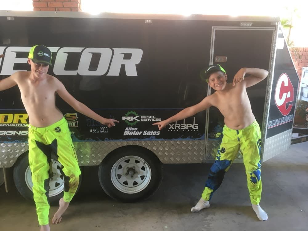 Two Boys Standing in Front of a Trailer — RK Diesel Services in Ciccone, NT