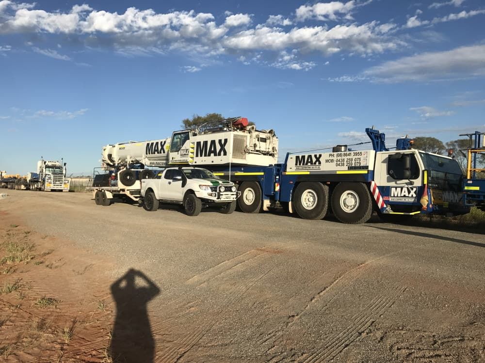 A Row of Trucks Parked on the Side of a Road — RK Diesel Services in Ciccone, NT