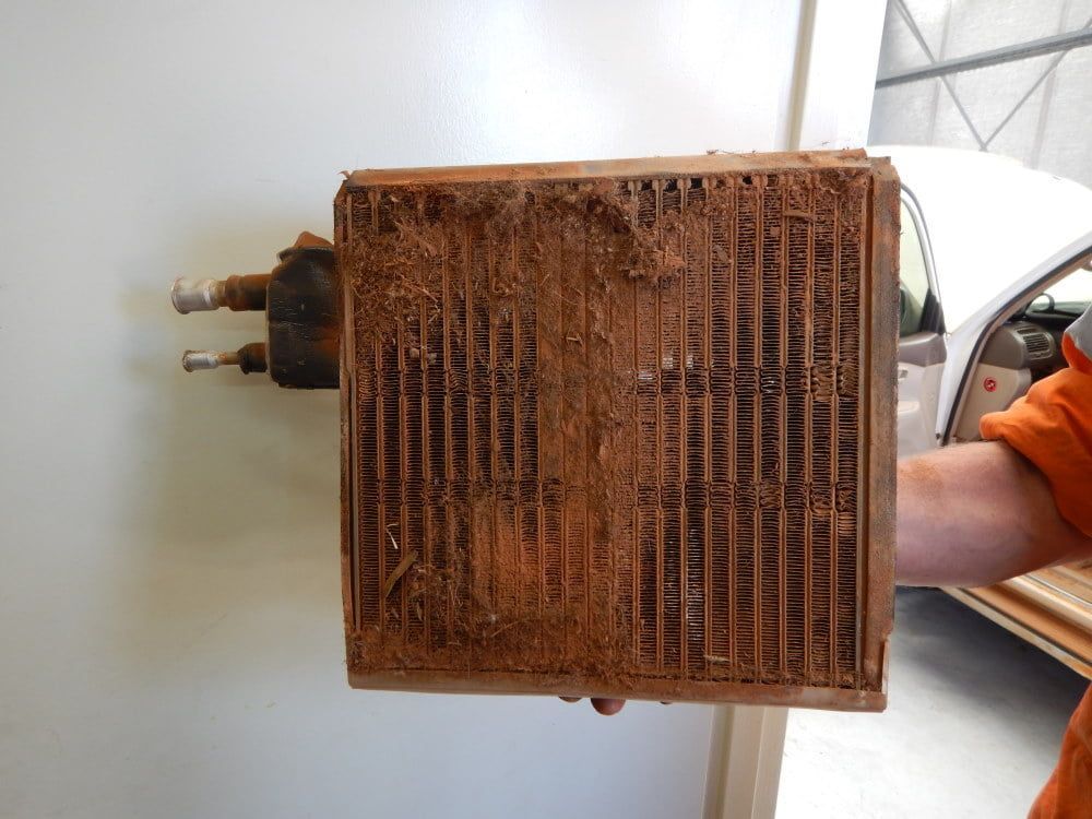 A Person is Holding a Piece of Wood With a Lot of Writing on It — RK Diesel Services in Ciccone, NT