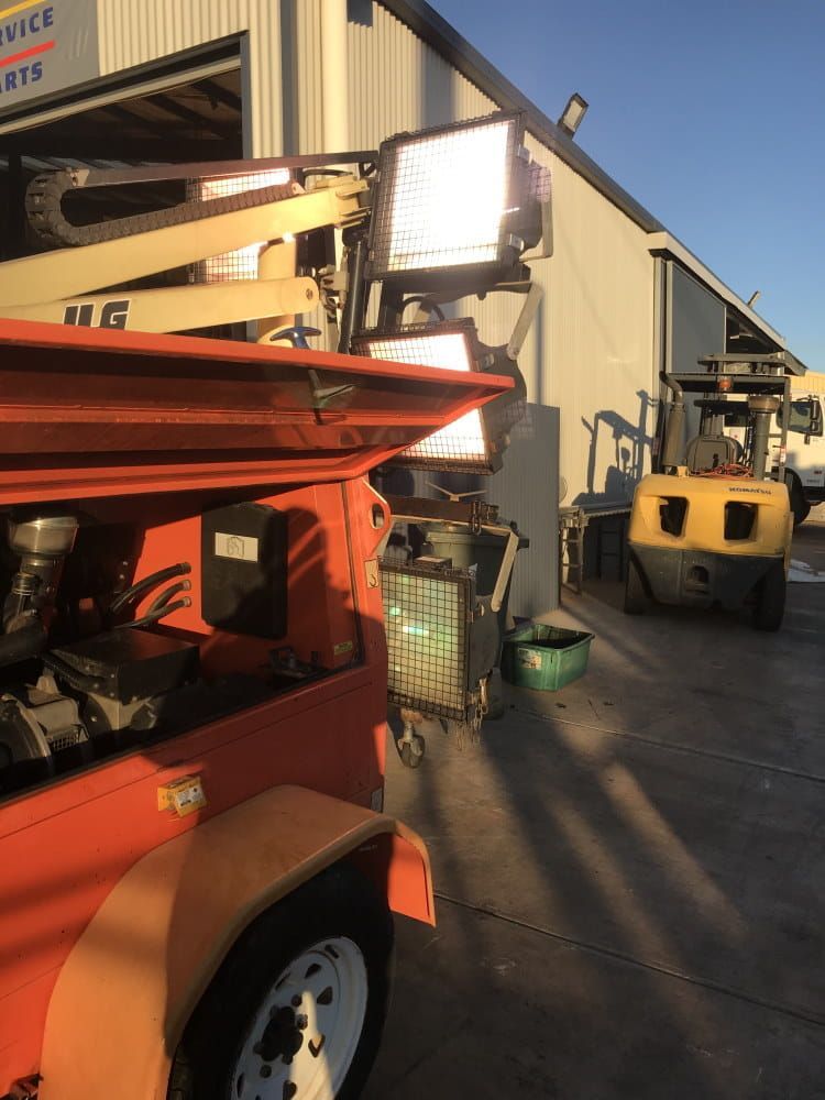 A Forklift is Parked in Front of a Building With Its Hood Open — RK Diesel Services in Ciccone, NT