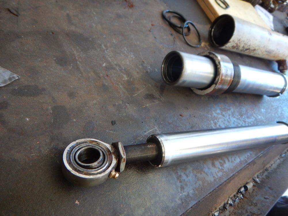 A Bunch of Metal Pipes Are Laying on a Table — RK Diesel Services in Ciccone, NT