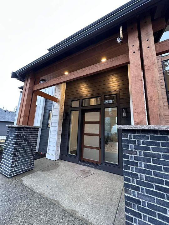 A ladder is sitting in front of a house under construction.