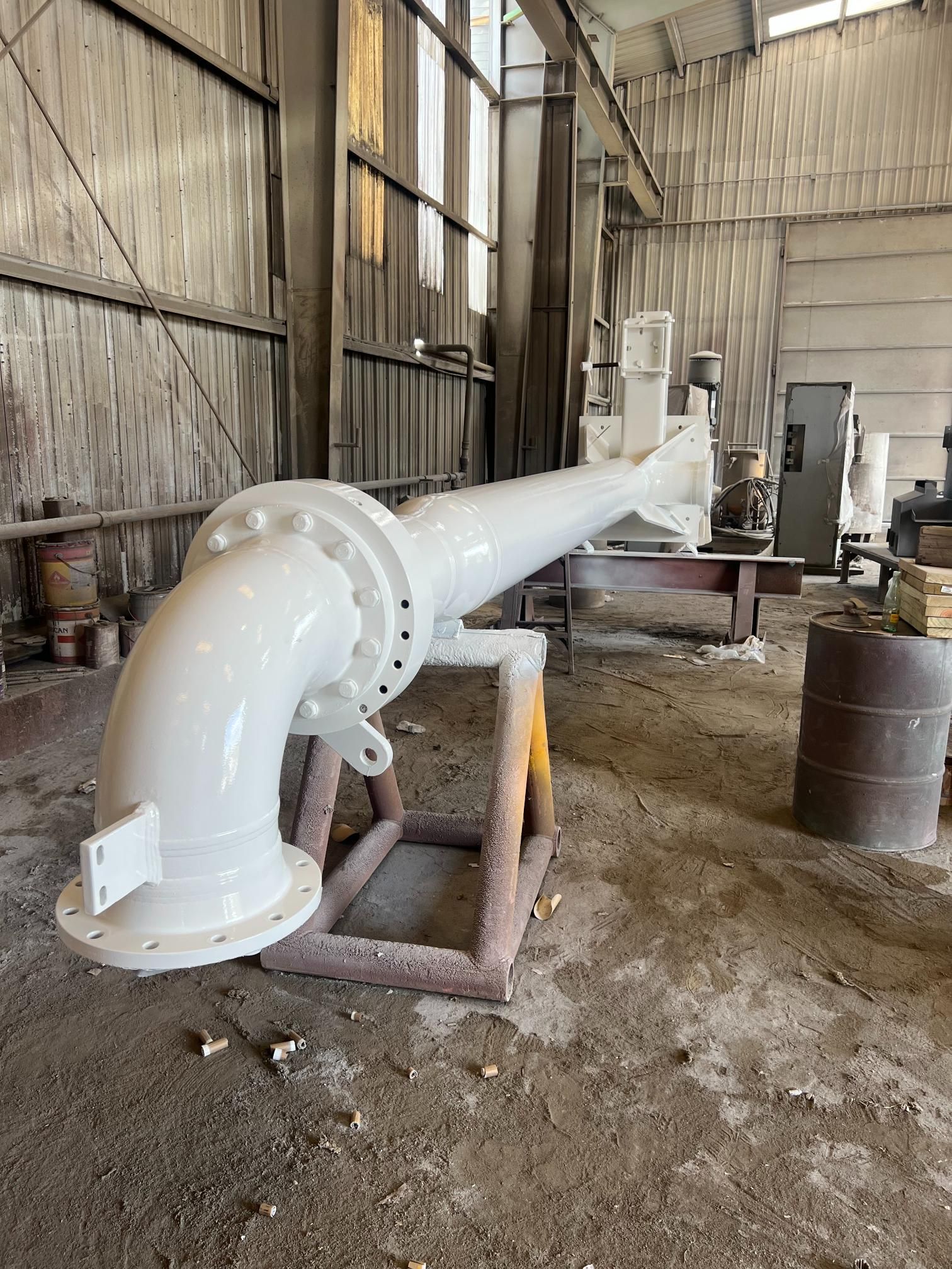 Black Santa Cruz mountain bike frame with blue lettering, foot in shoe.
